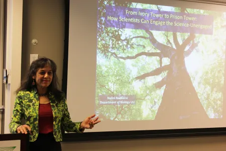 Nalini Nadkarni presenting in front of a projection screen